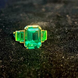 Lab created emerald with gold accents ring